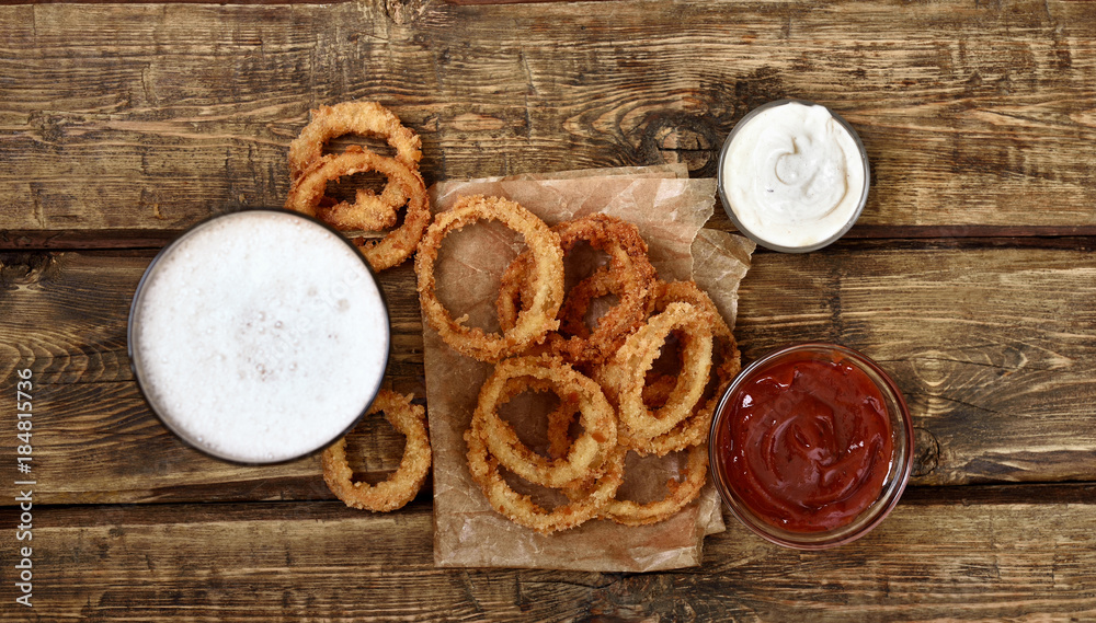 Fototapeta premium Fried onion rings, top view