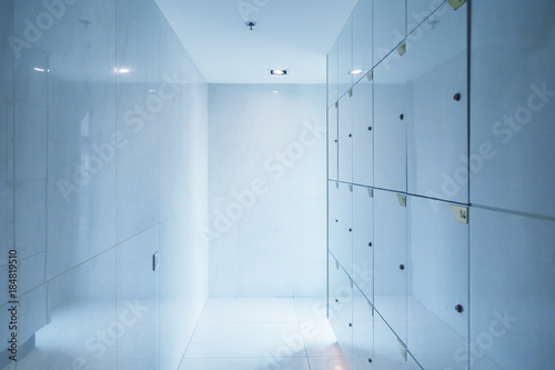 white corridor and locker with natural light