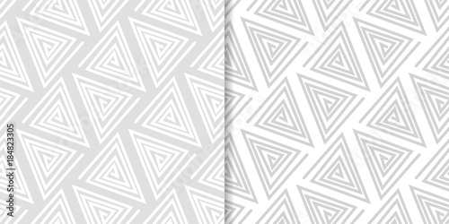 Light gray geometric ornaments. Set of seamless patterns