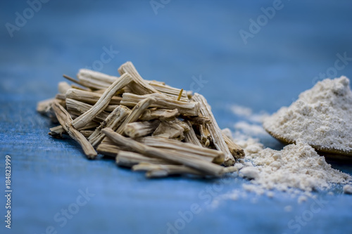 Close up of ayurvedic herb satavari,Asparagus racemosus with its powder and root. photo