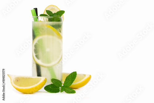Glass of lemonade with lemon and mint. Isolated on white background
