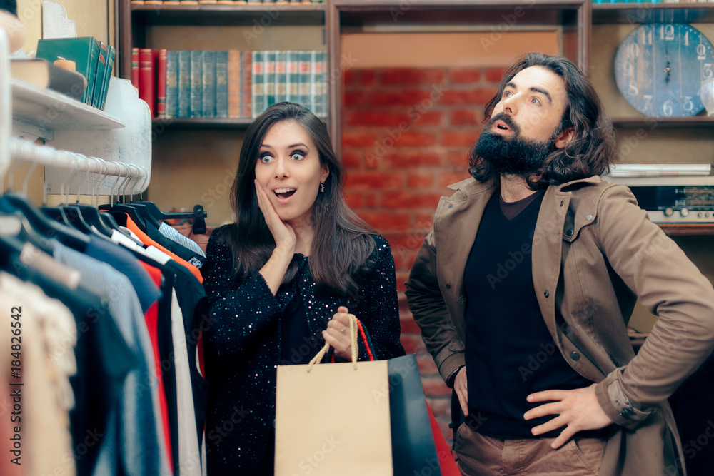 Couple Shopping for Clothes in Fashion Store Couple Shopping for Clothes in Fashion Store