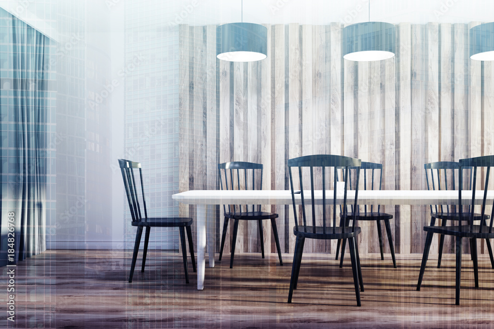 White and wooden dining room, black chairs toned