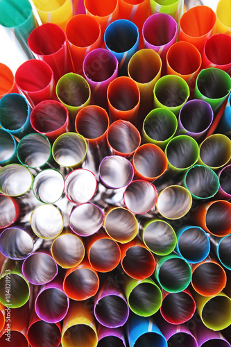 Fancy straw art background. Abstract wallpaper of colored fancy straws. Rainb...