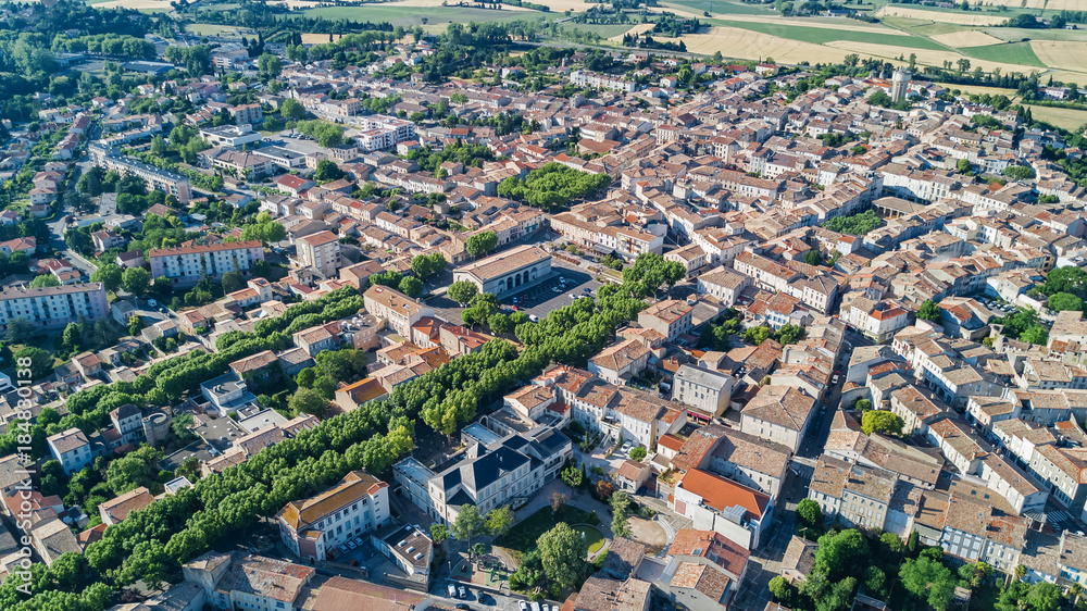 Aerial top view of residential area houses roofs and streets from above, old medieval town background, France
