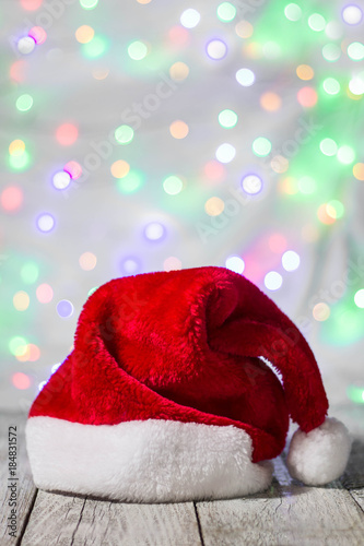 Red and white santa hat against bokeh background