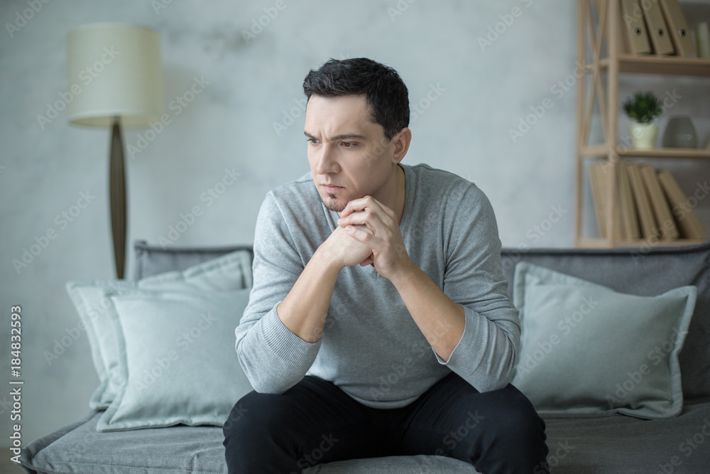 Man sitting upset psychology session mental health care Man sitting upset psychology session mental health care