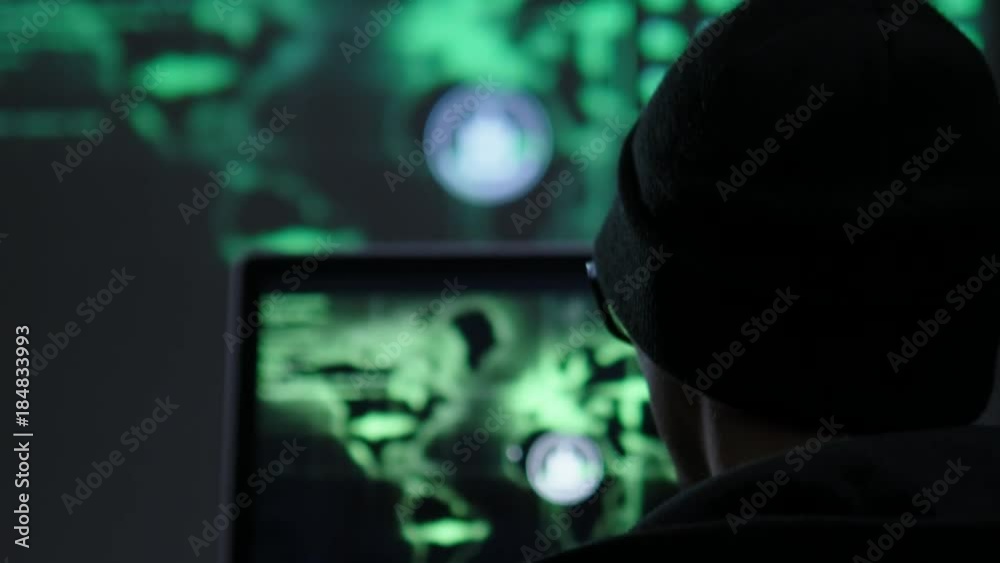 Serious man hacker during his work Serious man hacker during his work