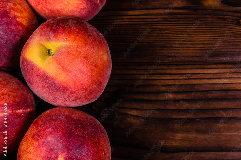 Fresh ripe peaches on wooden table. Top view Fresh ripe peaches on wooden table. Top view