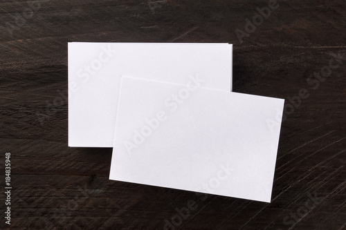 Overhead photo mockup of blank white business cards © laplateresca