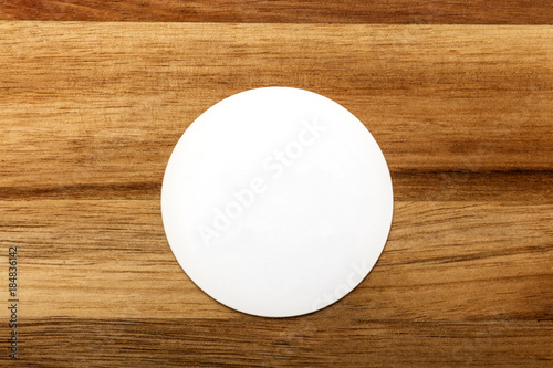 Mockup of round white business card on rustic background