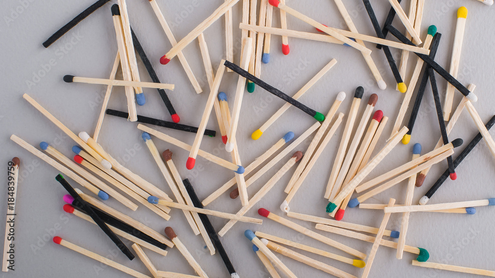 Many colorful wooden matches in random spread for background