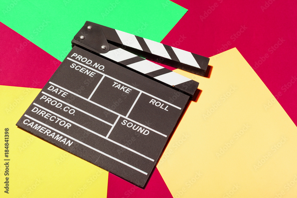 Naklejka premium Film clapper board on a table