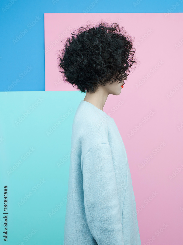 Fashion portrait of beautiful asian woman in sky-blue coat Fashion portrait of beautiful asian woman in sky-blue coat