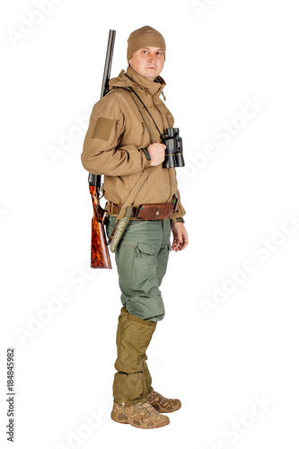 male hunter with double barreled shotgun