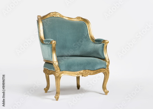 Golden and blue classic armchair isolated on white background