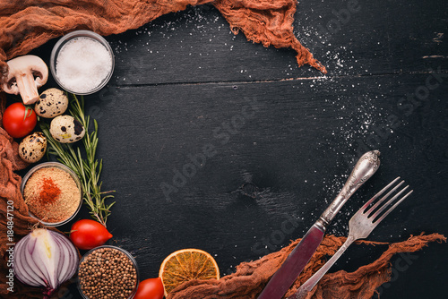 Fototapeta Naklejka Na Ścianę i Meble -  Vegetables, herbs and spices for cooking. Top view. The background of cooking. Free space for text.