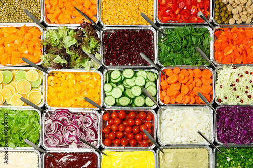 Top view of salad bar with assortment of ingredients photo