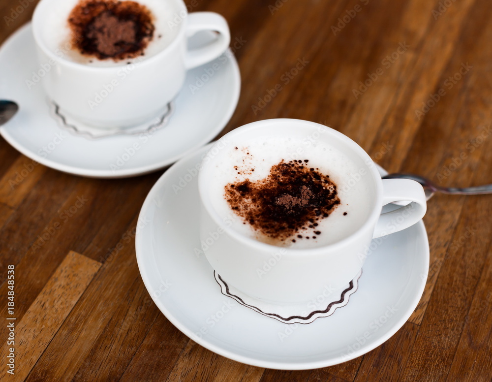 Fototapeta premium Food. Cup cappuccino coffee, wooden table