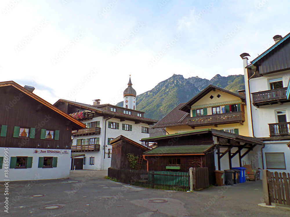 Beautiful town with traditional houses in the foothill of the Bavarian Alps, Oberammergau, Germany Beautiful town with traditional houses in the foothill of the Bavarian Alps, Oberammergau, Germany
