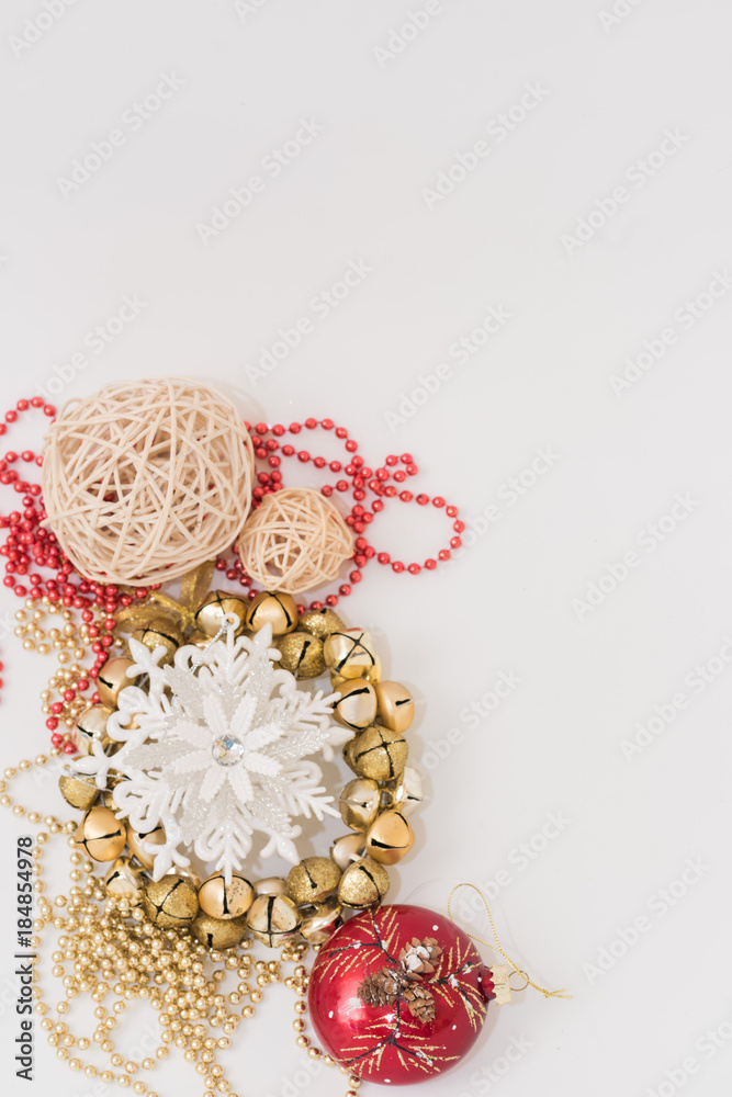 Christmas gift box with ribbon bow and ball toy and cone on white wooden vintage background Christmas gift box with ribbon bow and ball toy and cone on white wooden vintage background