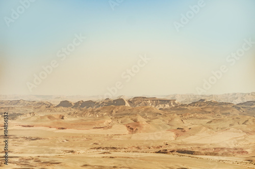 Landscape of negev desert in israel. View on scenic outdoor land of sand and mountains.