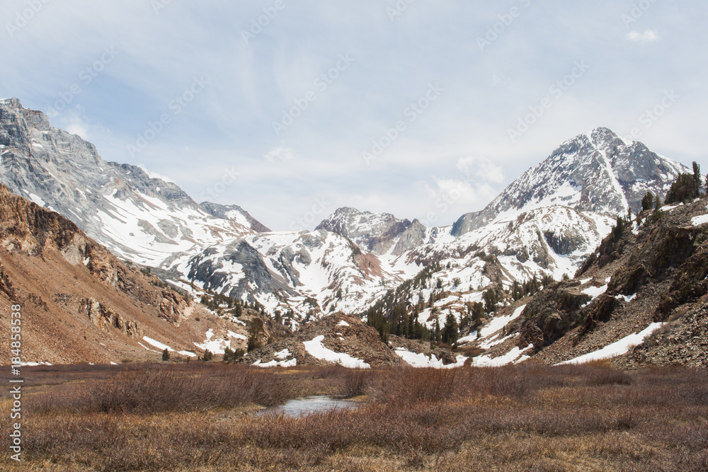 Scenic winter view of a lake and snow covered mountains in California. Scenic winter view of a lake and snow covered mountains in California.