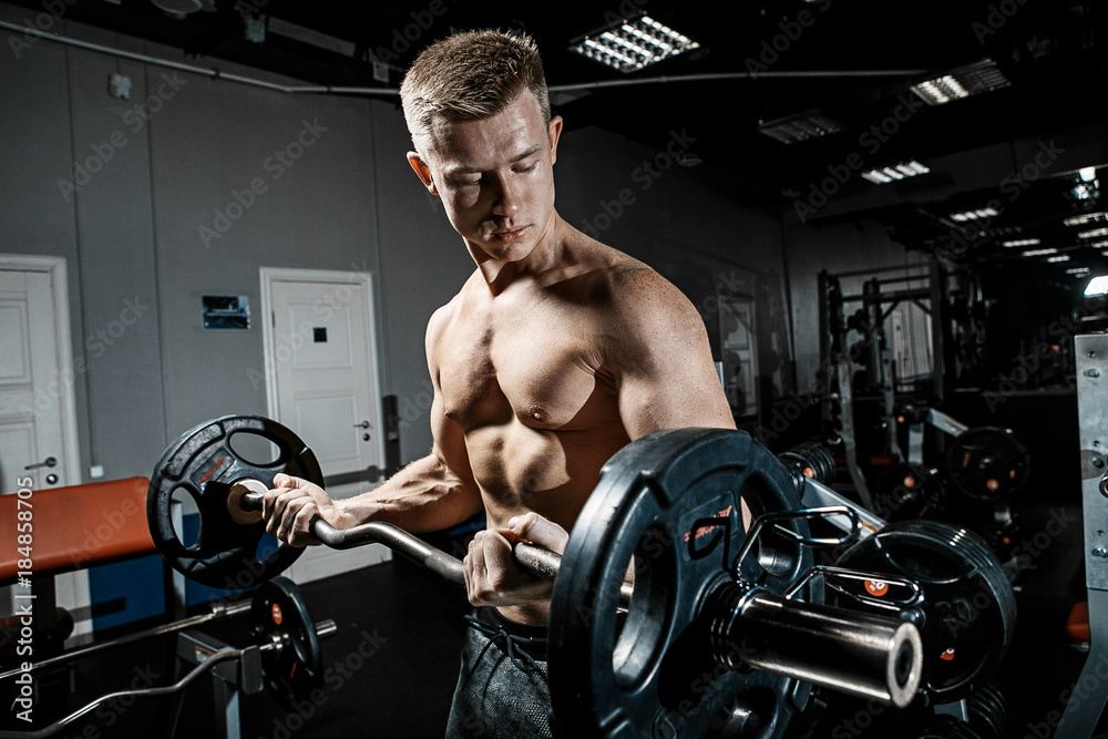 Strong man working in gym Strong man working in gym