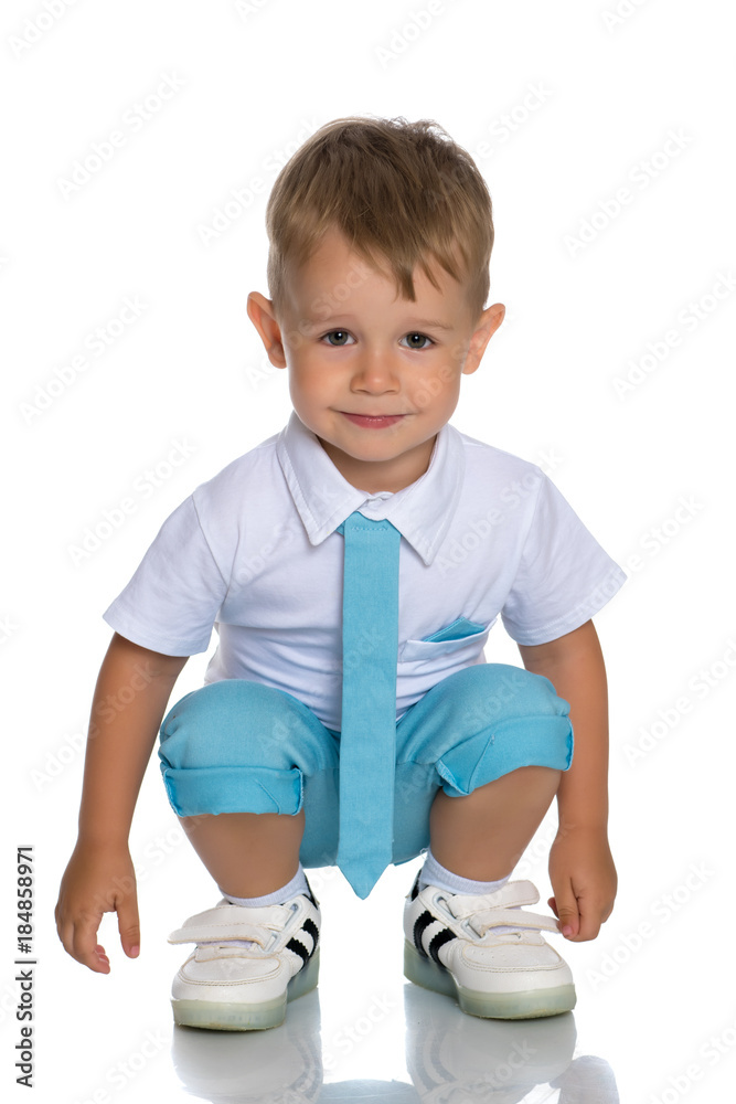 The little boy squatted down.