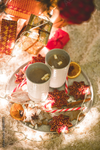 Hot chocolate drink with biscuits under the christmas tree