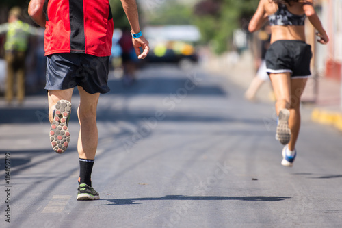 runners running marathon street
