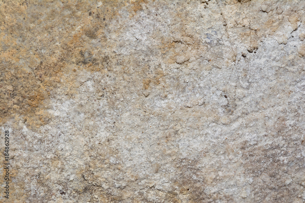 texture of the surface of an old antique wall with a plaster layer destroyed from moisture, a lot of cracks, blisters on the wall
