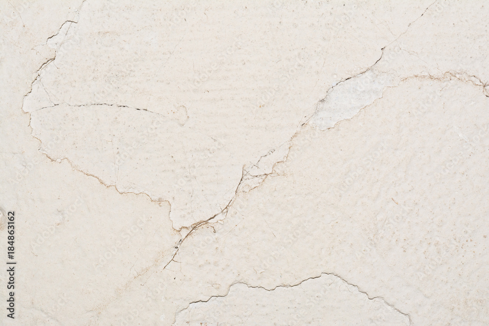 Obraz premium texture of the surface of an old antique wall with a plaster layer destroyed from moisture, a lot of cracks, blisters on the wall