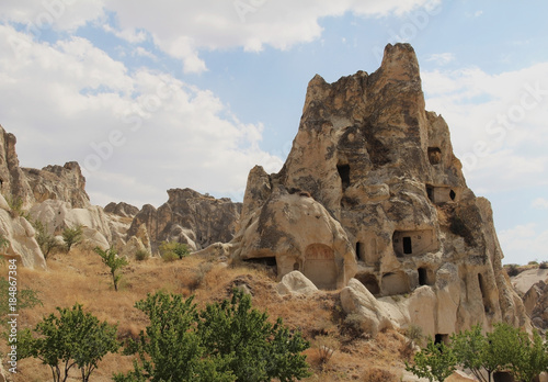 Natural valley with volcanic tuff stone rocks in the evening. Goreme, Cappadocia, Turkey.