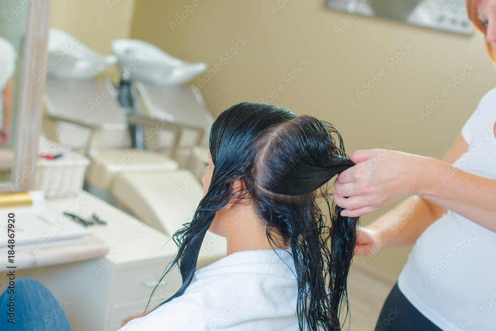 Lady in hairdressers, hair in sections Lady in hairdressers, hair in sections