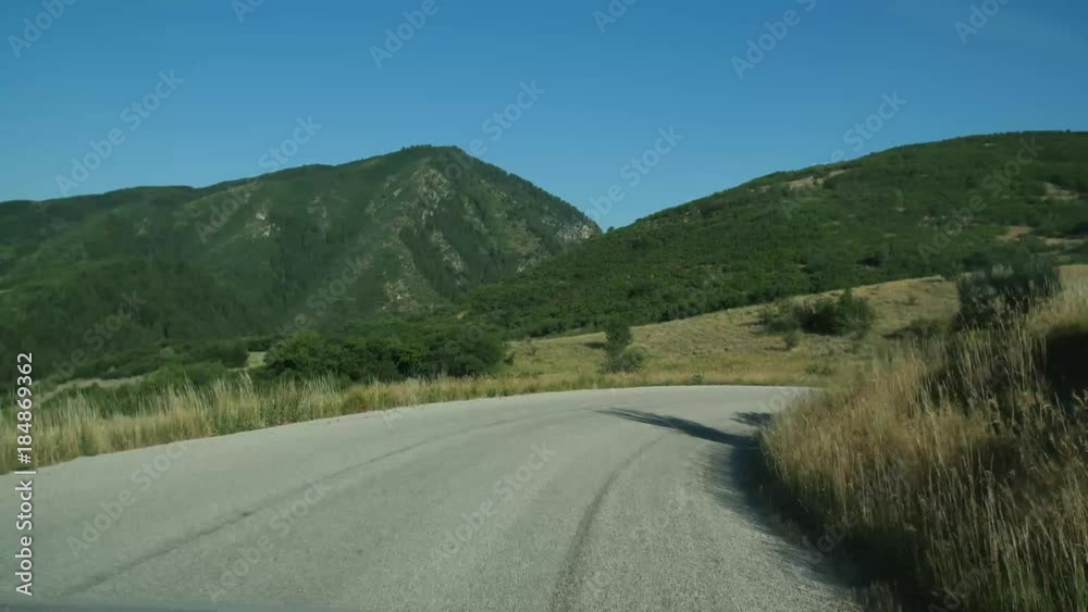 Mountain views near Snowbasin Resort in Utah are seen from a moving vehicle. Mountain views near Snowbasin Resort in Utah are seen from a moving vehicle.