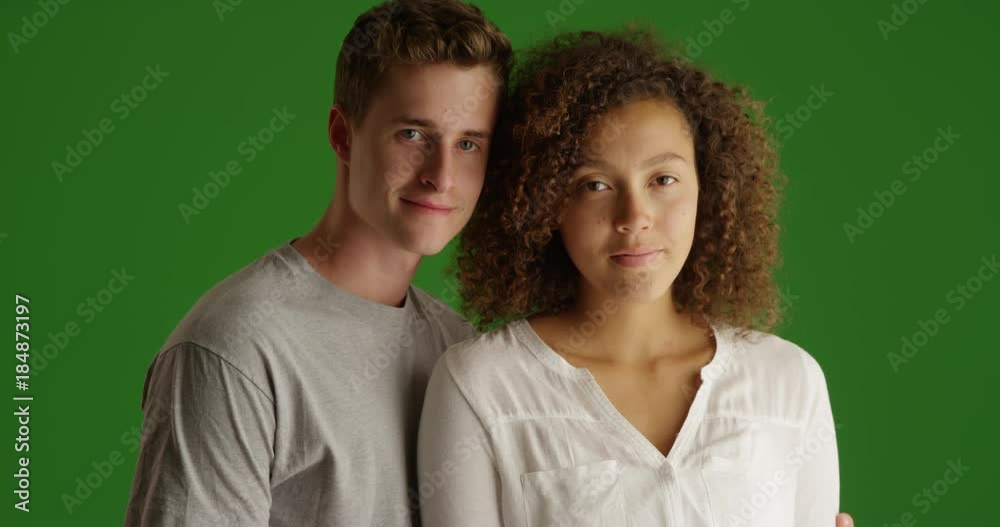 Happy couple smiling at home indoors on green screen. On green screen to be keyed or composited. Happy couple smiling at home indoors on green screen. On green screen to be keyed or composited.