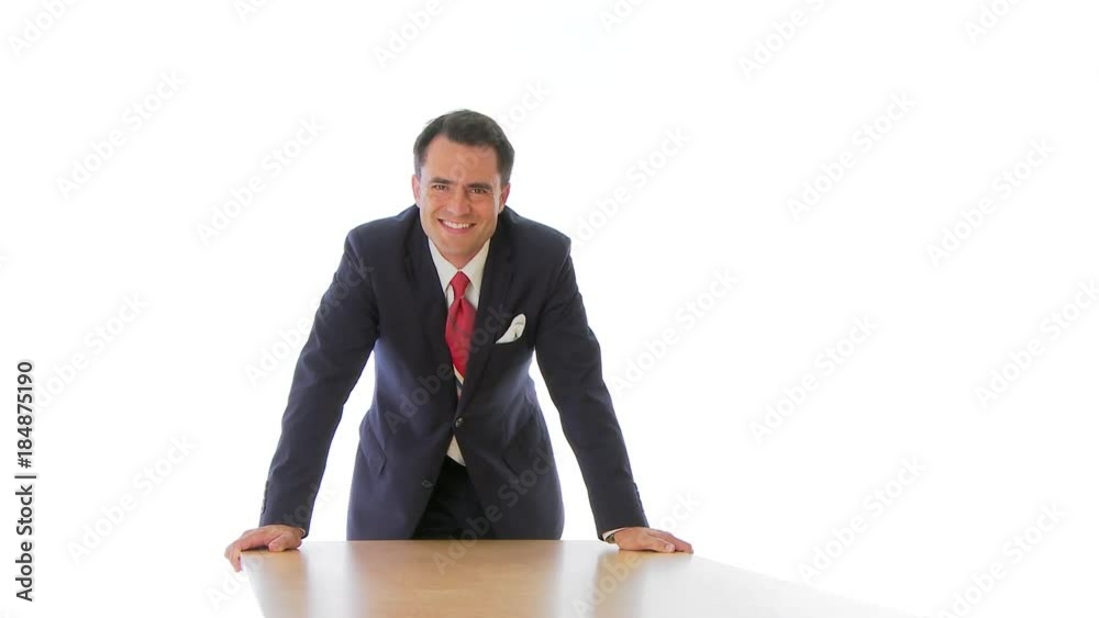 Smiling businessman standing over table Smiling businessman standing over table