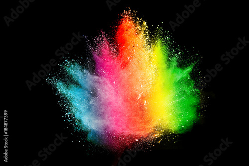 Freeze motion of colored powder explosions isolated on black background.