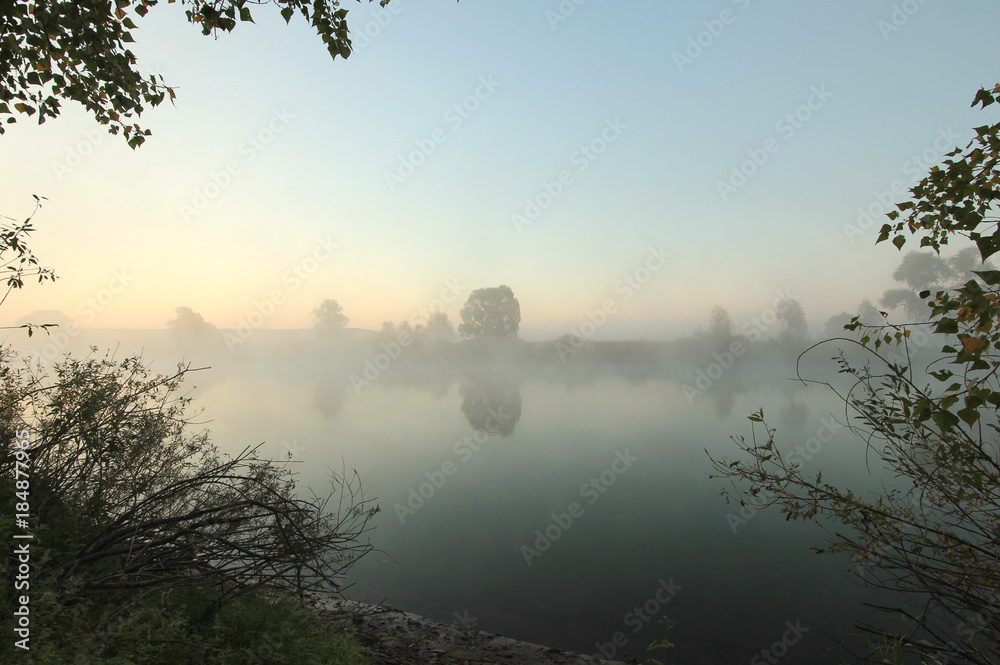 landscape with morning fog at sunrise at the river