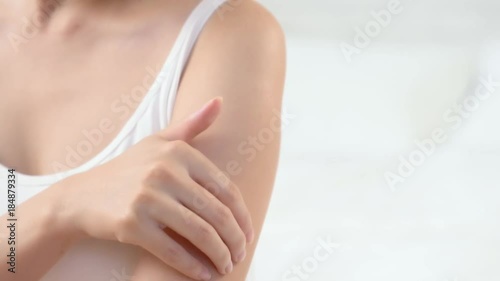 female touch shoulder arm skin.