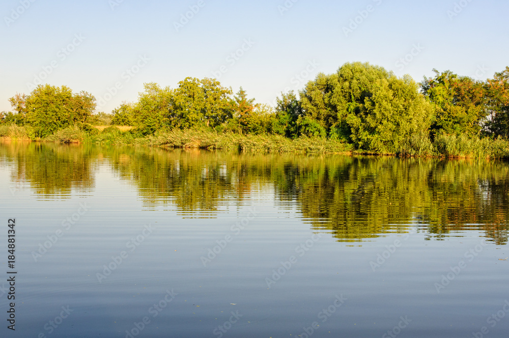 Reflections in the scenic Holt-Koros River at Bekesszentandras, Hungary Reflections in the scenic Holt-Koros River at Bekesszentandras, Hungary
