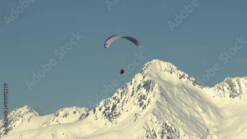 The Parachutist Plans In The Sky Near The Ridge
