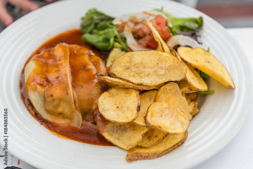 Quinta com Quiejo a typical dish consisting of a meat burger and Azorean cheese in Ponta Delgada on the island of Sao Miguel in the Azores, Portugal Quinta com Quiejo a typical dish consisting of a meat burger and Azorean cheese in Ponta Delgada on the island of Sao Miguel in the Azores, Portugal