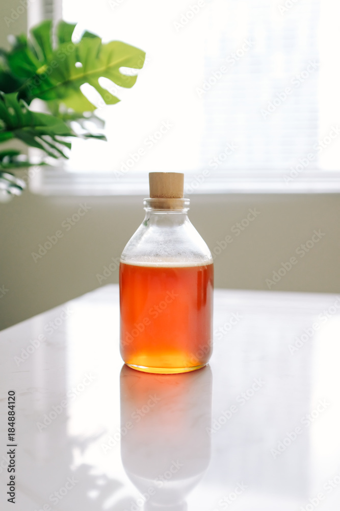 Glass can full of honey on table. Glass can full of honey on table.