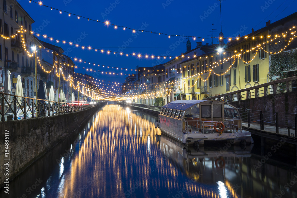 Obraz premium Milan, Italy: The Naviglio Grande canal waterway with Christmas light, night view. This district is famous for its restaurants, cafes, pubs and nightlife.