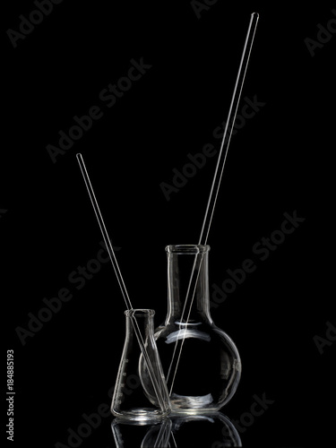 Laboratory glassware on black background