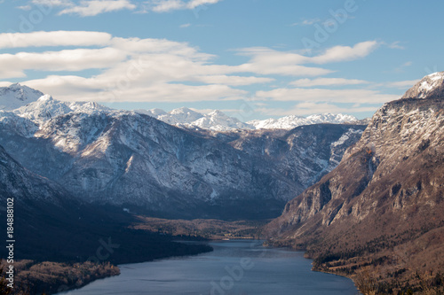 Bohinj lake with snowy mountains in autumn