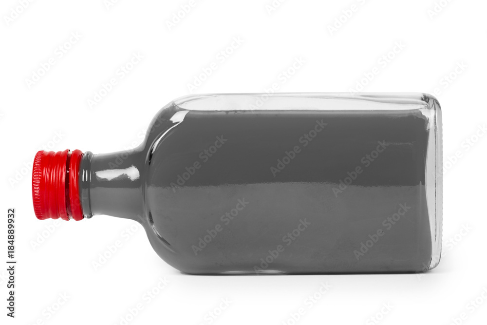 Glass bottle with red tincture isolated on white background. Alcohol problem Glass bottle with red tincture isolated on white background. Alcohol problem