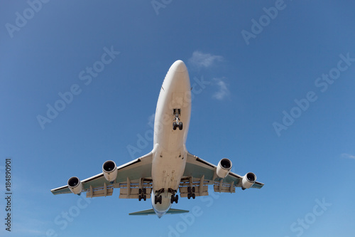 Passenger airplane in blue sky background.